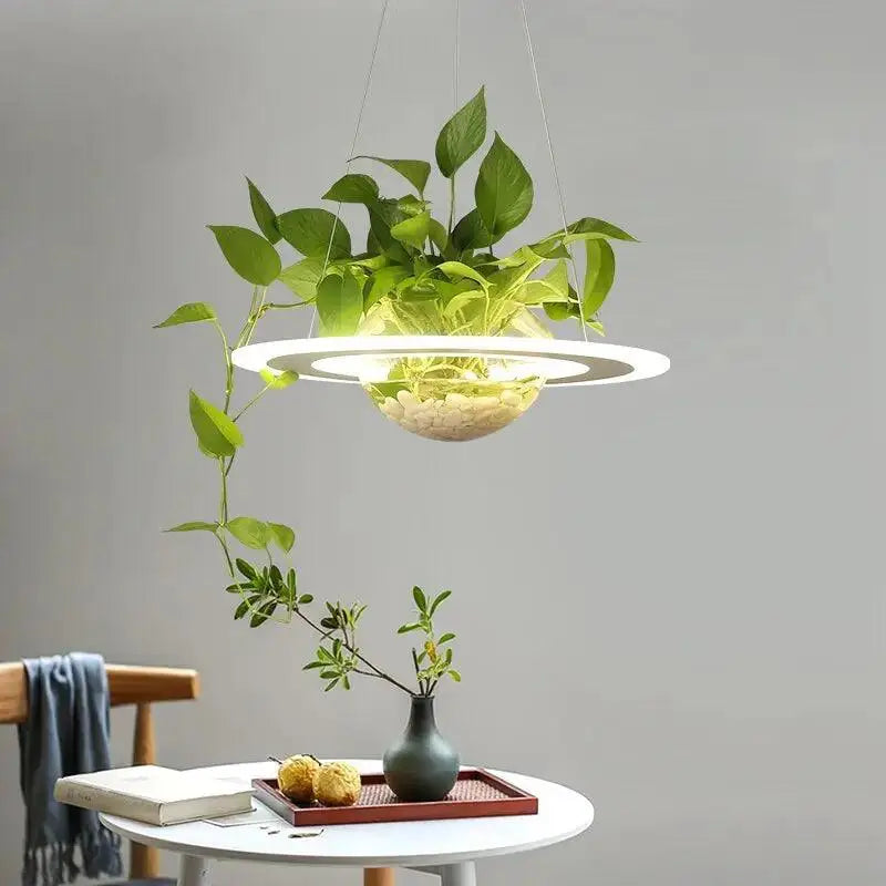 Modern white DecorBites™ planter light table pendant with integrated plant growth chamber and hanging green vines