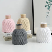 Set of four DecorBites™ ceramic vases in pastel colors with ribbed texture and rope necks for flower arrangement use