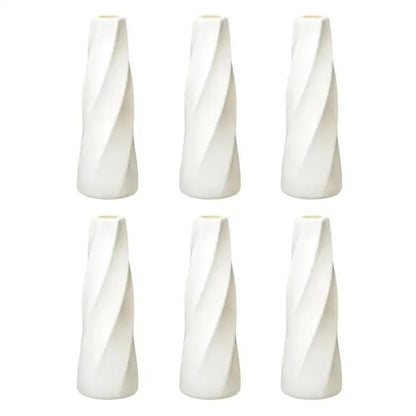Set of six white ceramic flower vases with sleek twisted design from decorbites plastic retro flower vases collection