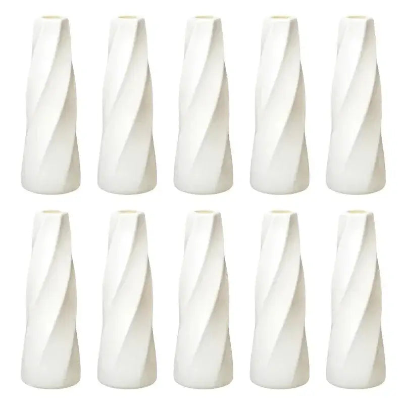 Set of ten white ceramic flower vases with sleek twisted design for modern home decor and floral displays
