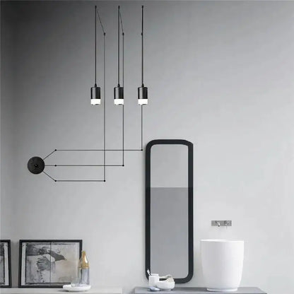 Decorbites™ plug-in hanging lights feature black cylindrical minimalist plug-in hanging lights for modern interiors