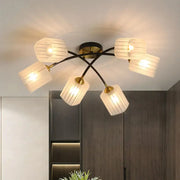 Decorbites™ post modern brass semi-flush mount ceiling light with six frosted glass shades and gold-toned accents