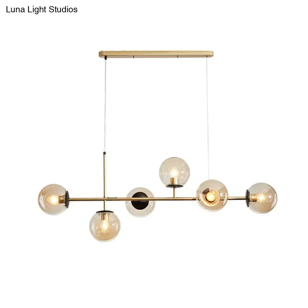 DecorBites postmodern brass pendant light with six glass ball shades in blue white gold for dining rooms