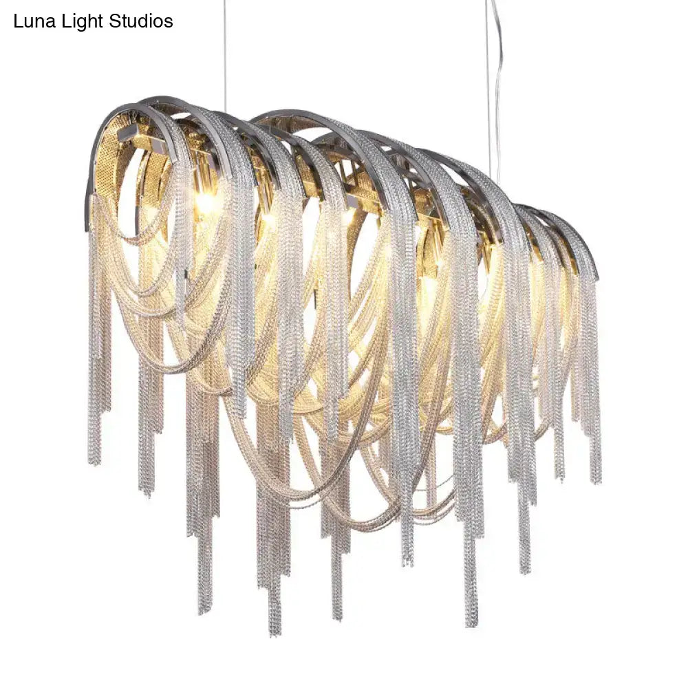 A modern silver aluminum tassel pendant lighting ceiling light with cascading chain fringe and sleek curved design