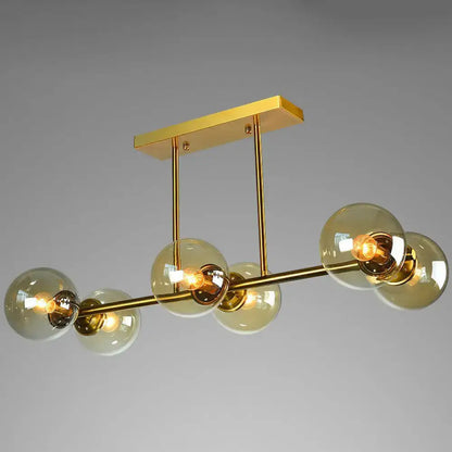 Decorbites™ postmodern brass island light with gold-toned metal frame and five amber globe glass shades ceiling fixture