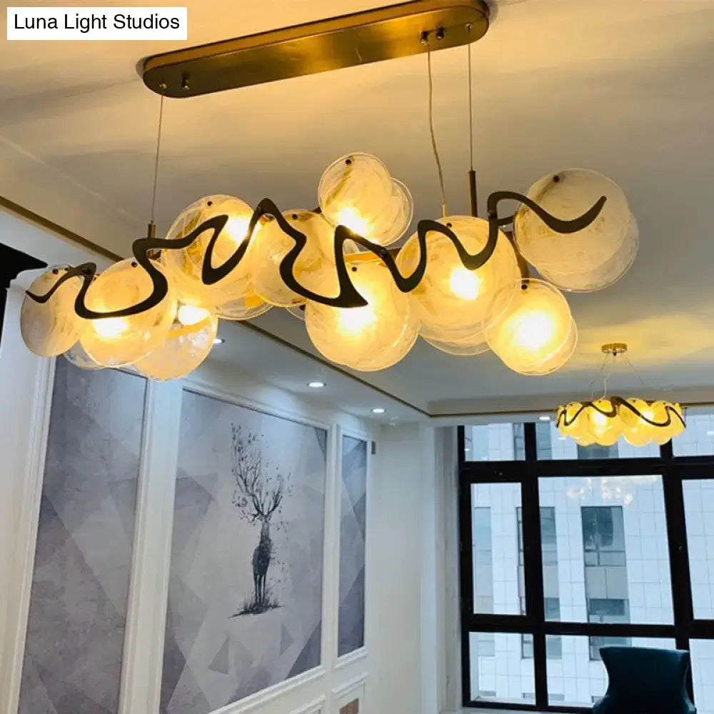 DecorBites™ postmodern circle pendant light with warm-toned glass shades and black metal accents LED fixture