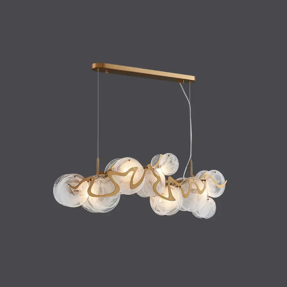 Decorbites postmodern circle pendant light with gold-toned brass, clear glass globe bulbs, and metallic accents for dining areas