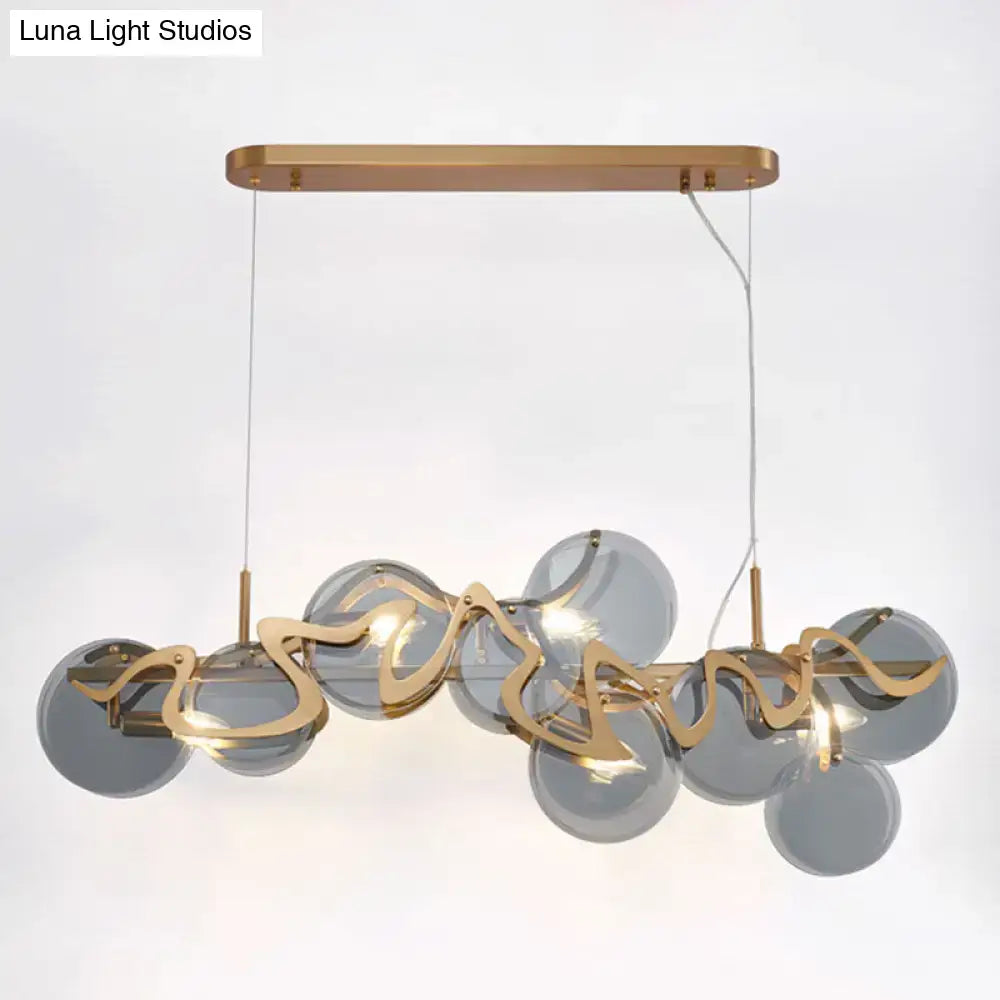 DecorBites™ postmodern gold-toned pendant light with gray glass spheres and metallic accents for restaurant island fixture