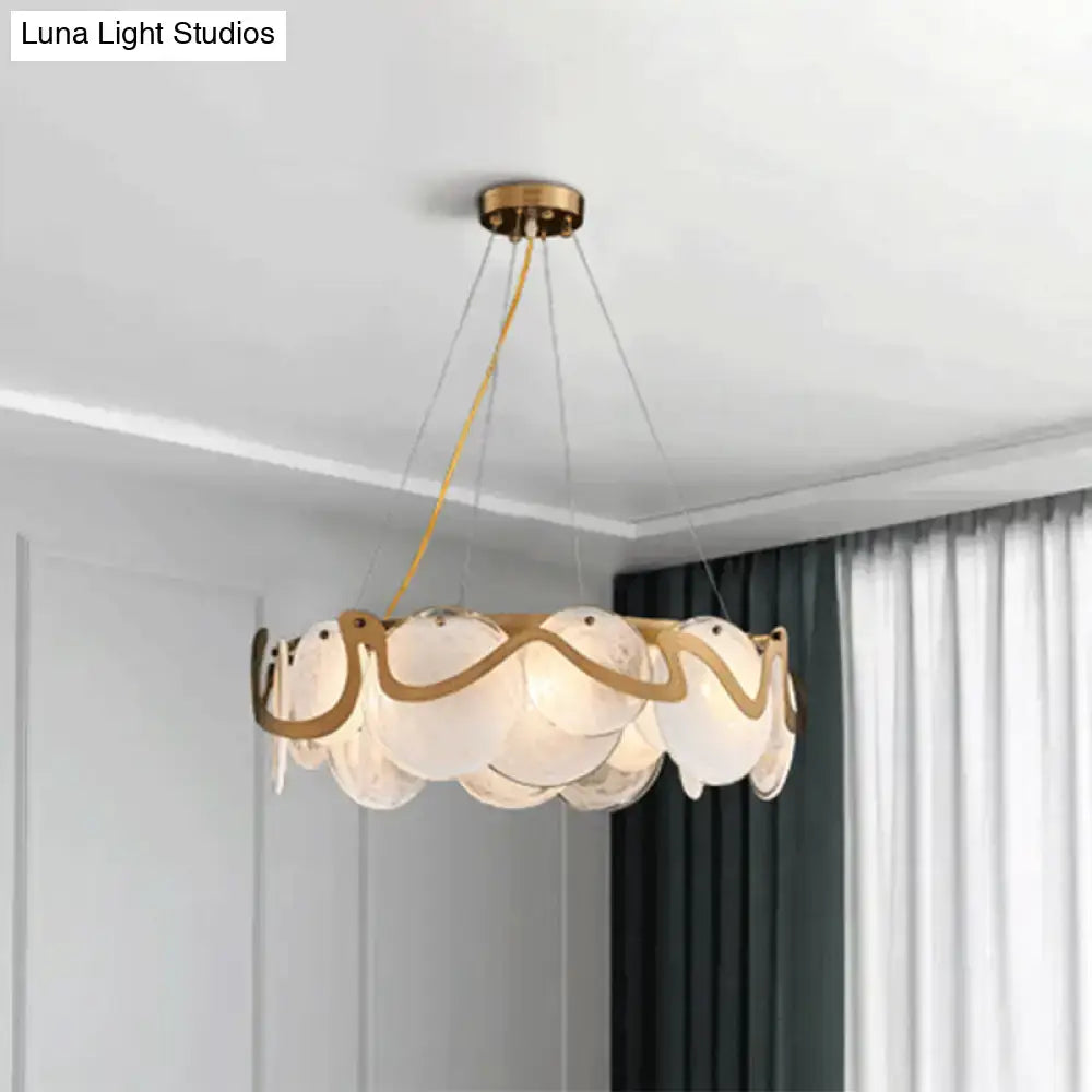 Decorbites postmodern circle pendant light with gold-toned brass frame and translucent scalloped glass discs light fixture