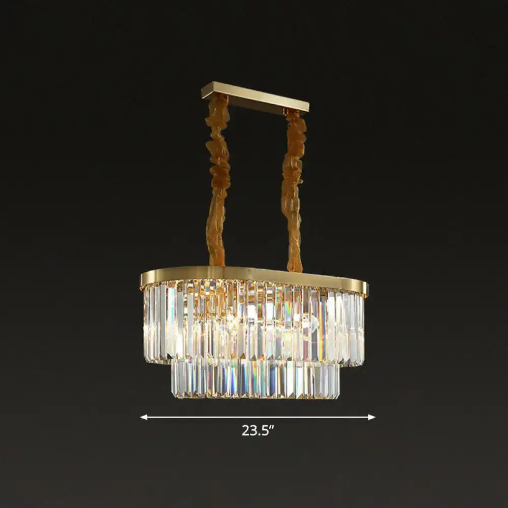 Gold-toned postmodern oblong island light with two tiers of clear crystal rods and sculptural brass chains for dining room