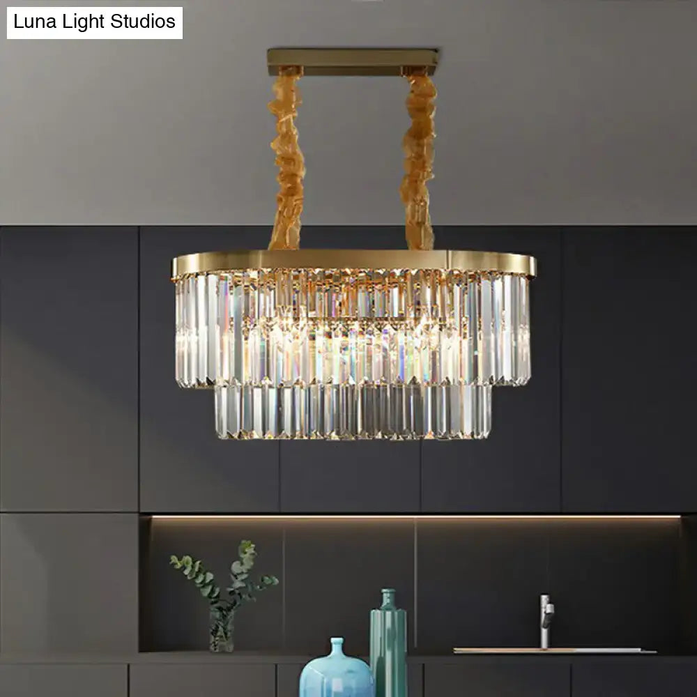Gold-toned DecorBites postmodern oblong island light with cascading clear crystal rods and twisted brass chains in brass finish