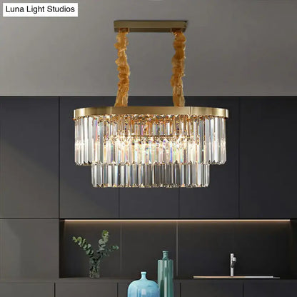 Gold-toned DecorBites postmodern oblong island light with cascading clear crystal rods and twisted brass chains in brass finish