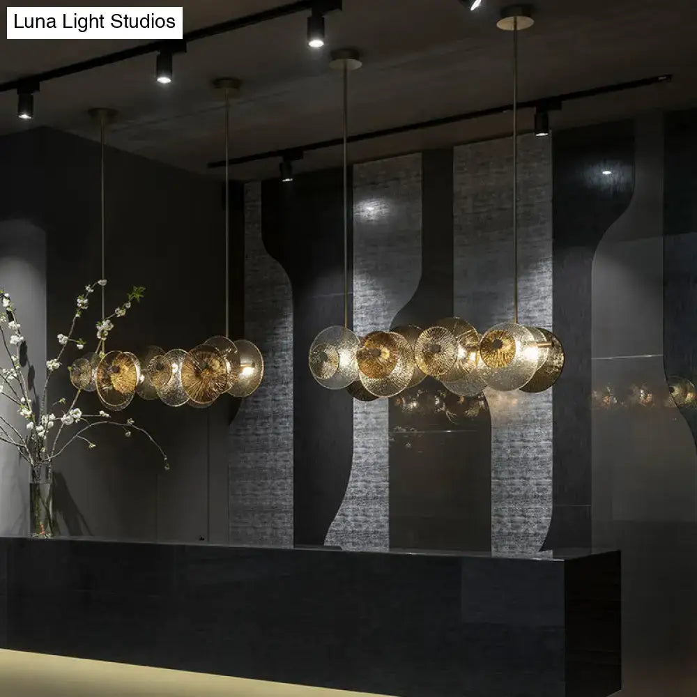 Golden circular glass pendant lights with mesh detailing in decorbites™ postmodern disc textured 4-light brass chandelier for 220v-240v use