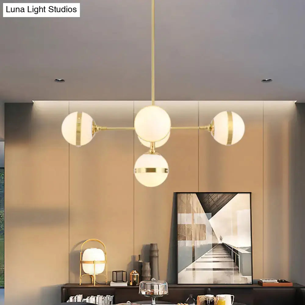 Decorbites postmodern gold branch pendant light with modern brass finish and four white ball glass spheres