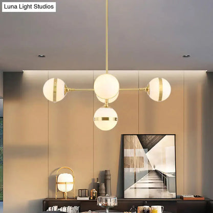 Decorbites postmodern gold branch pendant light with modern brass finish and four white ball glass spheres