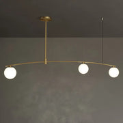 Decorbites postmodern gold island pendant light with brass finish and three frosted white glass orb hanging lamps