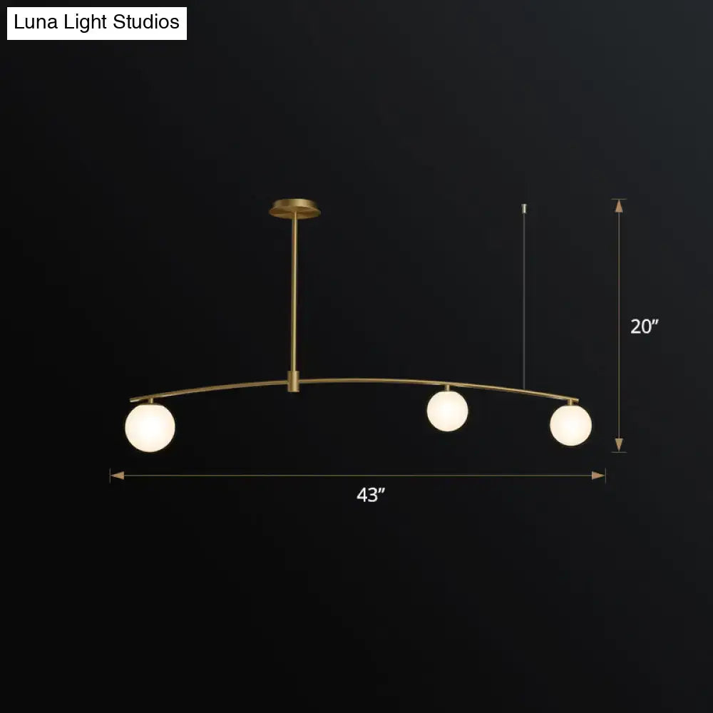 Brass-finished DecorBites postmodern hanging lamp with three frosted white glass orb lights for modern interiors