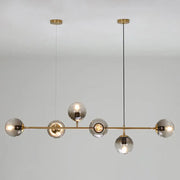 Modern brass pendant light with five smoked glass globes from decorbites™ postmodern gold island pendant set with e26 e27 bulbs