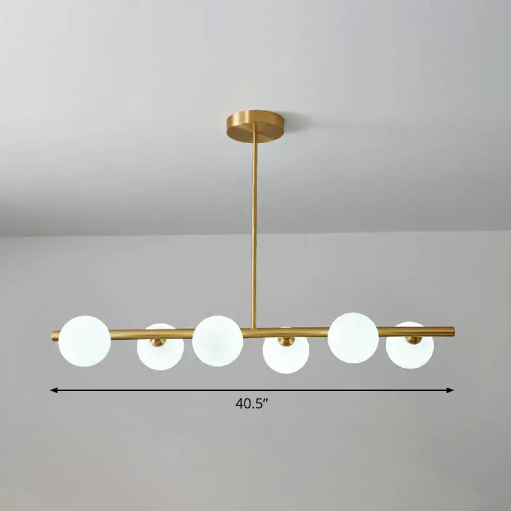 DecorBites postmodern linear island lamp features a gold-toned pendant light with five frosted glass globes for dining room