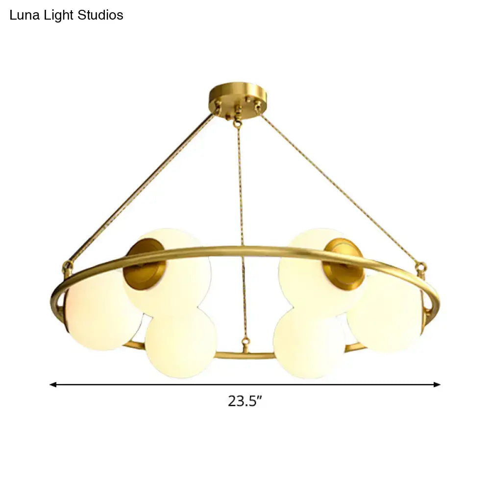 Decorbites™ postmodern metal chandelier with brass finish circular frame and five frosted glass globe shades