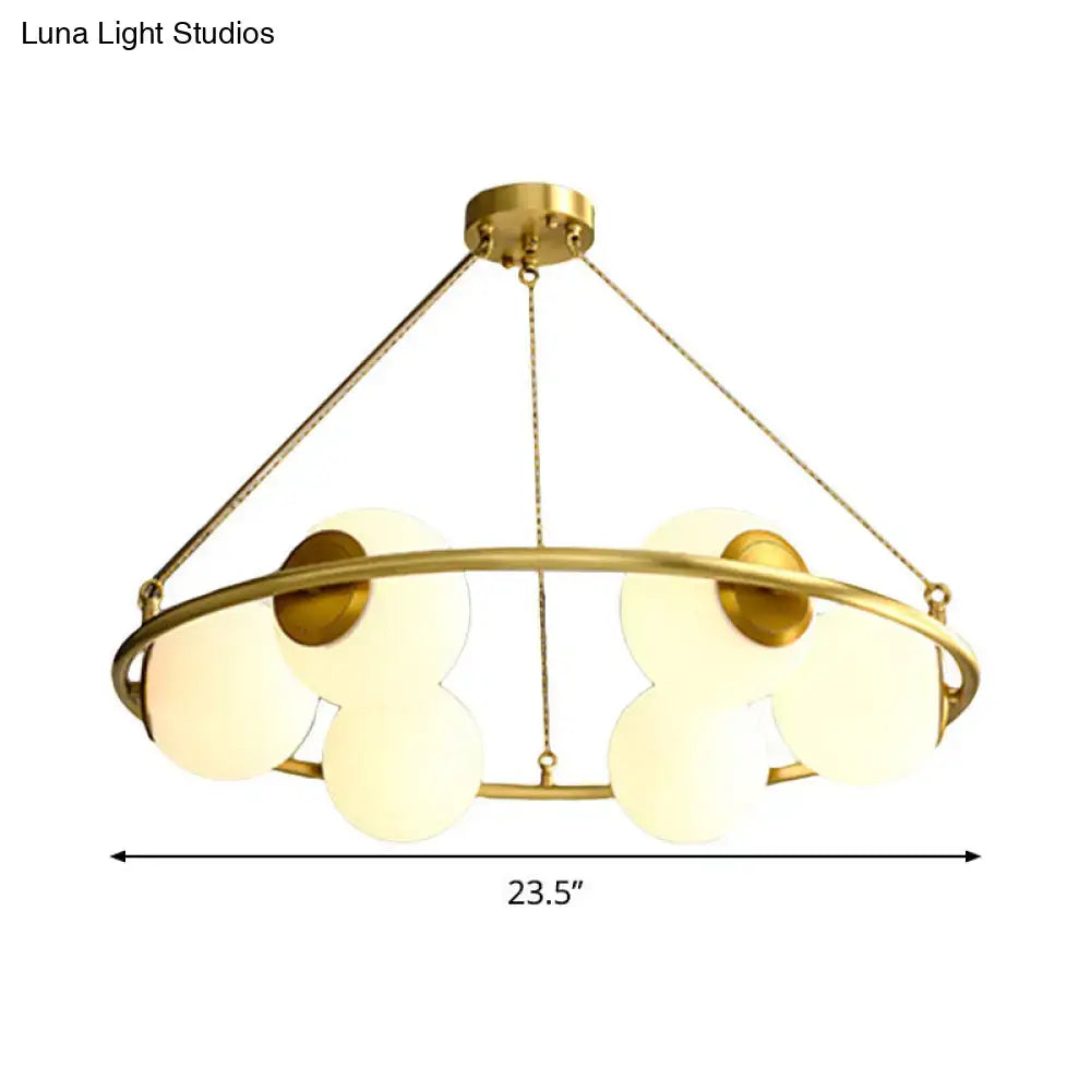 Decorbites postmodern circular chandelier light with six frosted glass shades in brass finish metal frame