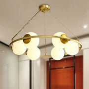 Decorbites postmodern metal chandelier with brass finish circular frame and six frosted glass globe shades