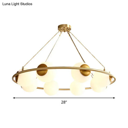 Decorbites™ postmodern circular chandelier light with brass finish and frosted glass globe shades suspended by chains