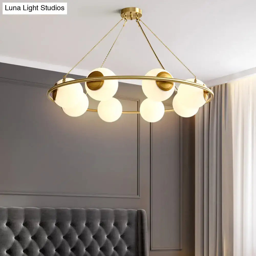 DecorBites™ postmodern metal chandelier with brass finish circular frame and frosted glass globe shades 6/8 lights