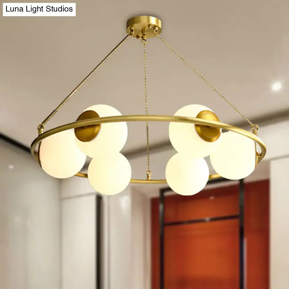 Decorbites postmodern brass finish circular chandelier light with six frosted glass globe shades in metal frame