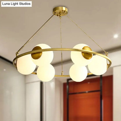 Decorbites postmodern brass finish circular chandelier light with six frosted glass globe shades in metal frame
