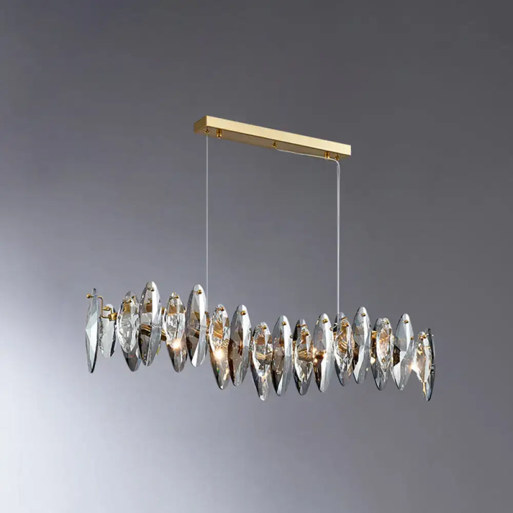 A modern rectangular gold metal chandelier with faceted crystal pendants for postmodern smoke grey glass lighting
