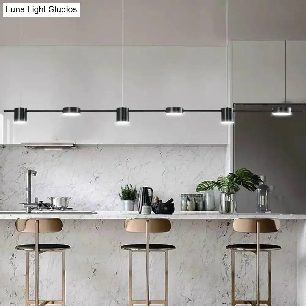 Modern black metal decorbites™ postmodern straight bar led ceiling light with five cylindrical fixtures above kitchen island