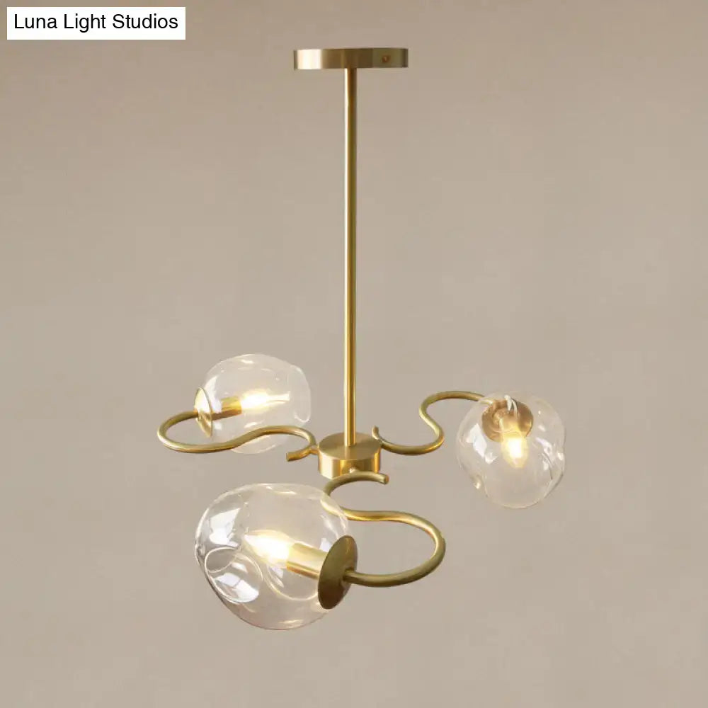Brass-finished semi-flush mount chandelier with three clear glass globes and curved organic metal arms for bedroom e12 e14