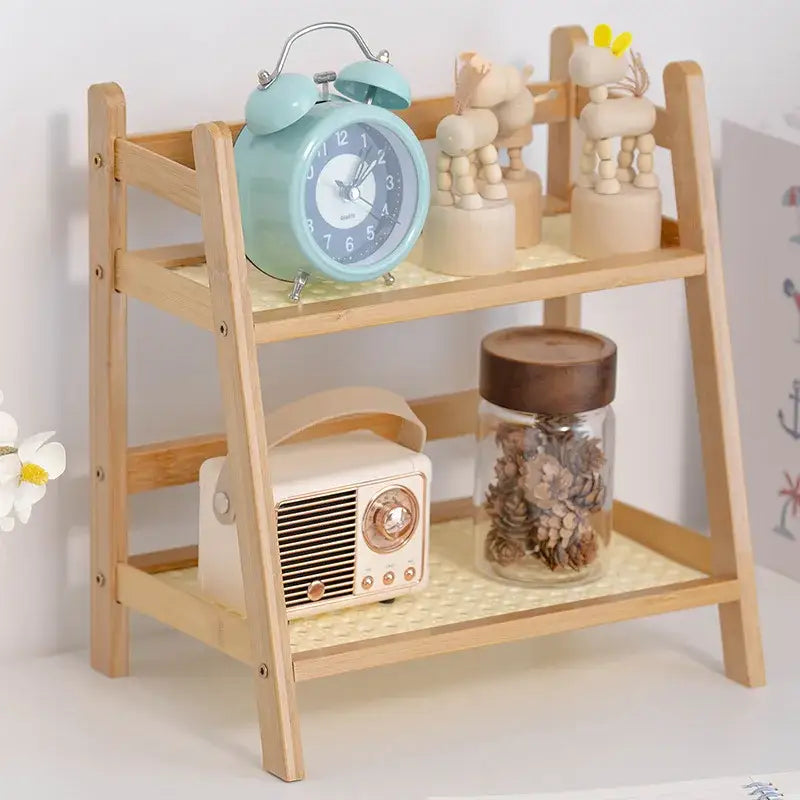 Light blue vintage-style alarm clock on white face with silver accents on DecorBites™ rattan desktop organizer shelf