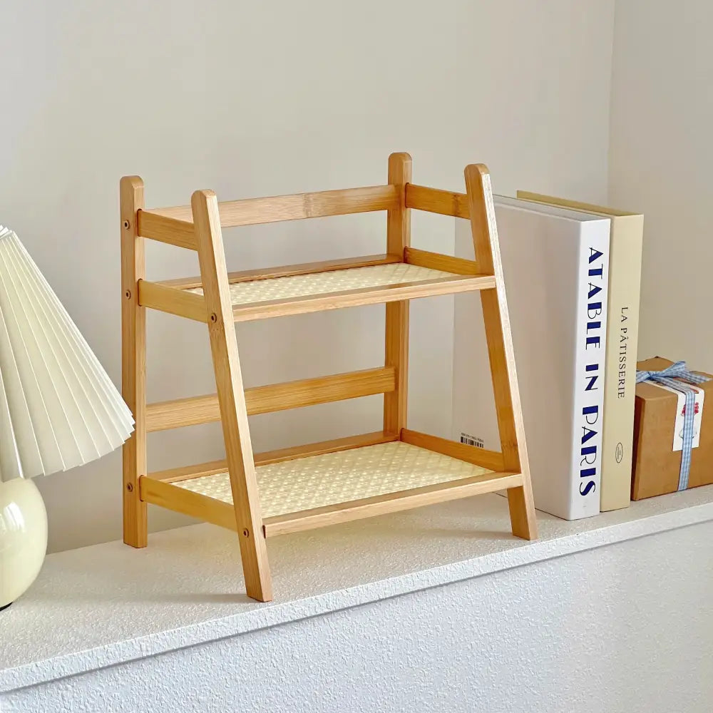 Light-colored wooden two-tier desktop organizer shelf with woven rattan-style shelves by DecorBites™