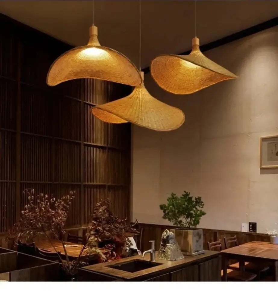 Three golden-brown woven bamboo pendant lights with dimmable rattan shades for natural pendant light rattan decor