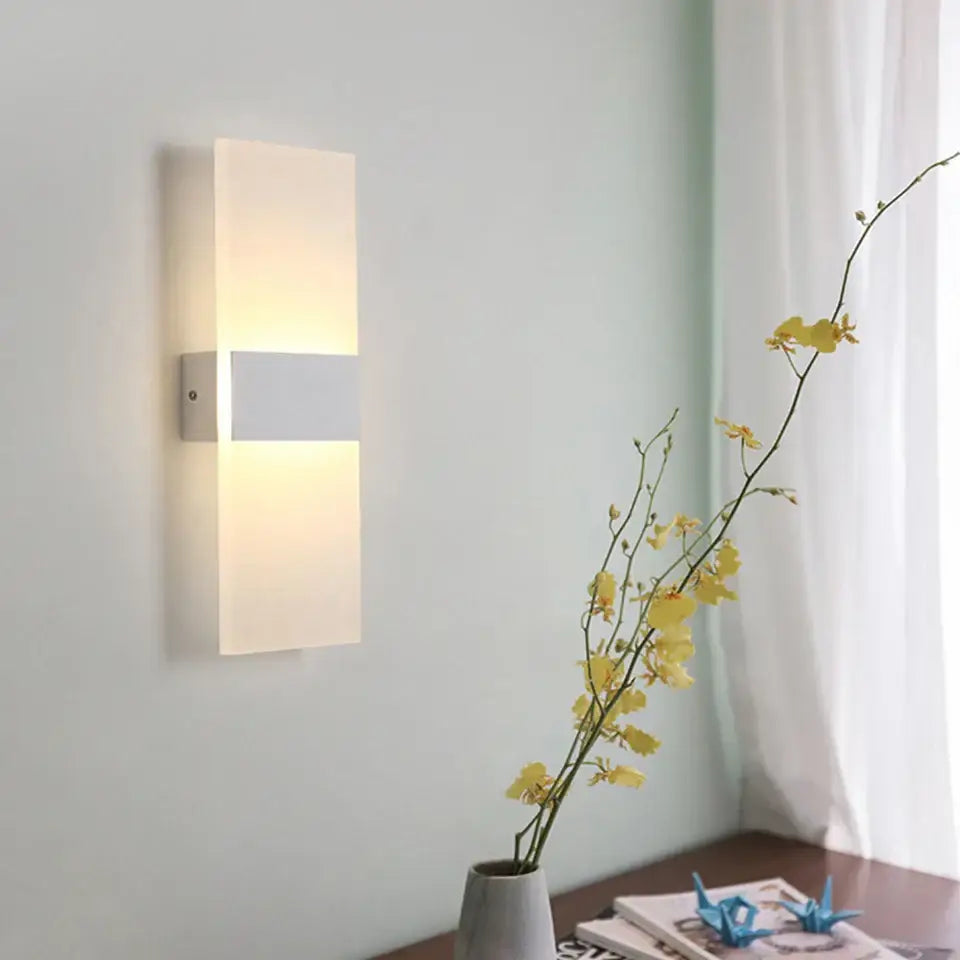 Modern rectangular rechargeable wall light by Rikard with frosted glass diffuser and metallic accents, battery operated wall light