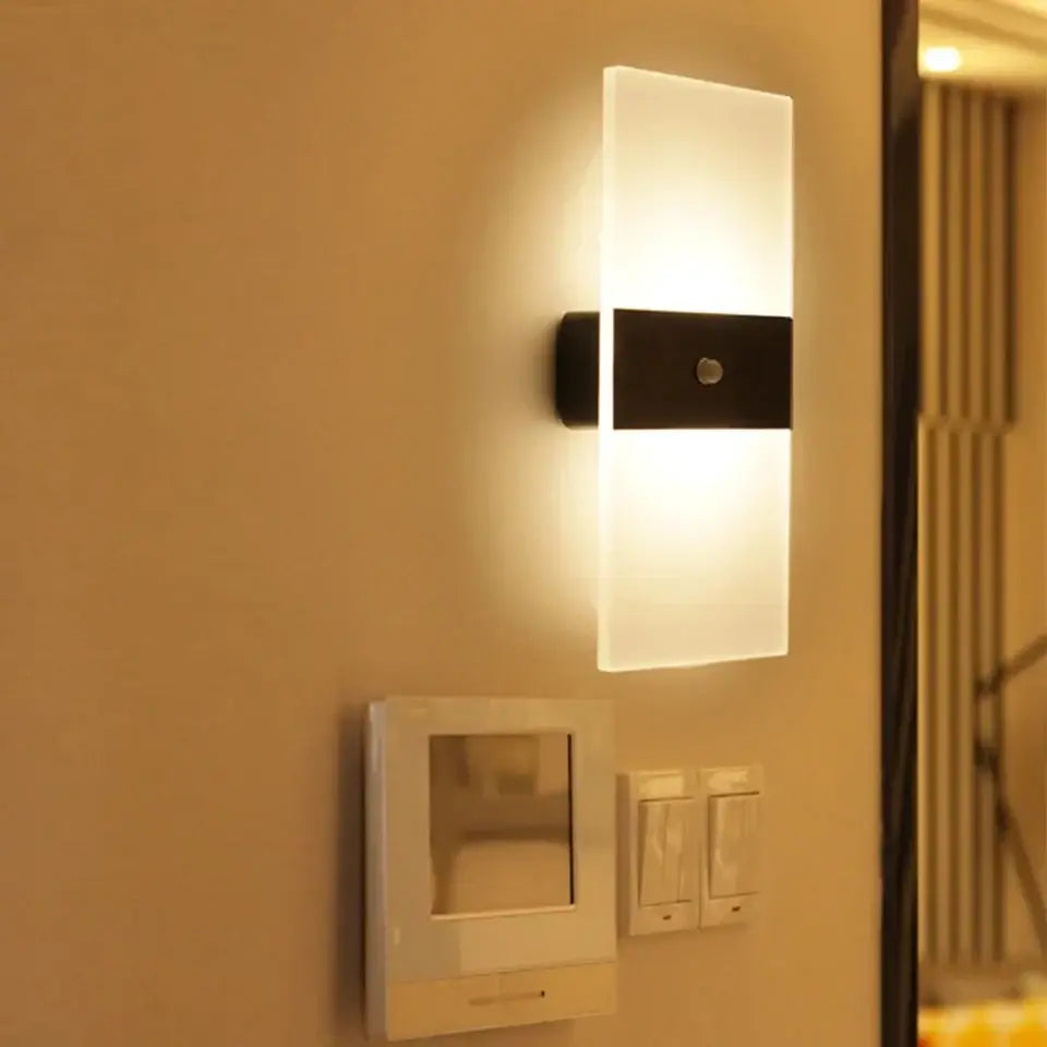 Modern rectangular rechargeable wall light by rikard with frosted glass and black metal housing battery operated wall light