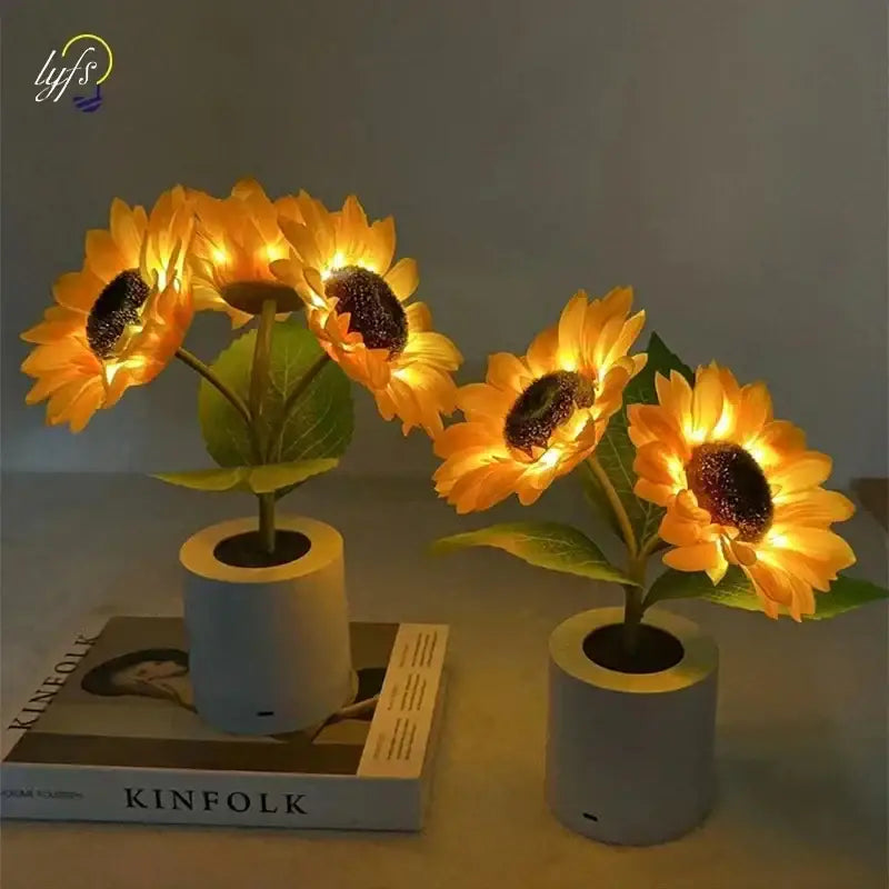 Two decorbites rechargeable sunflower led night lights with bright yellow petals in gray cylindrical pots for bedroom use