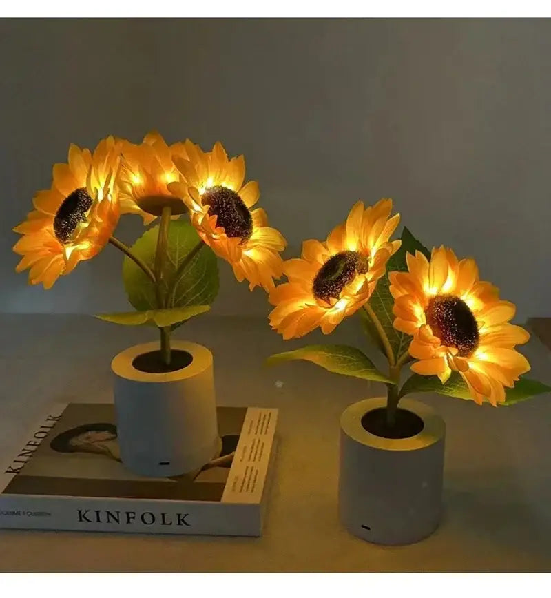 Two decorbites™ rechargeable sunflower led night lights with yellow petals and gray pots perfect for bedroom use