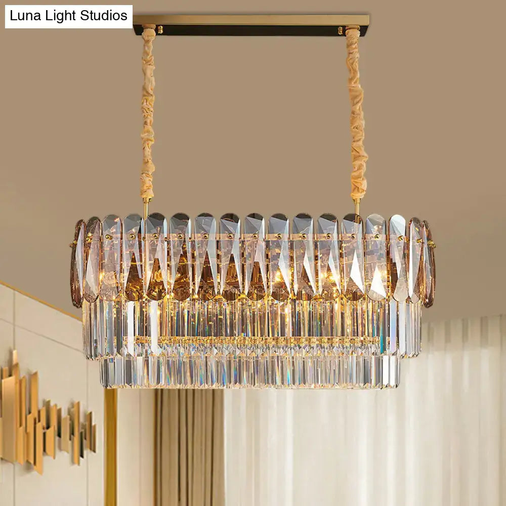 Decorbites rectangular dining room pendant with three tiers of amber and smoke gray crystal prisms on gold cords