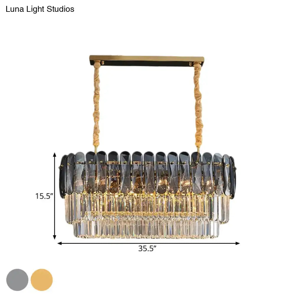 Elegant rectangular dining room pendant with smoke gray and clear crystal droplets on gold-toned frame and twisted ropes