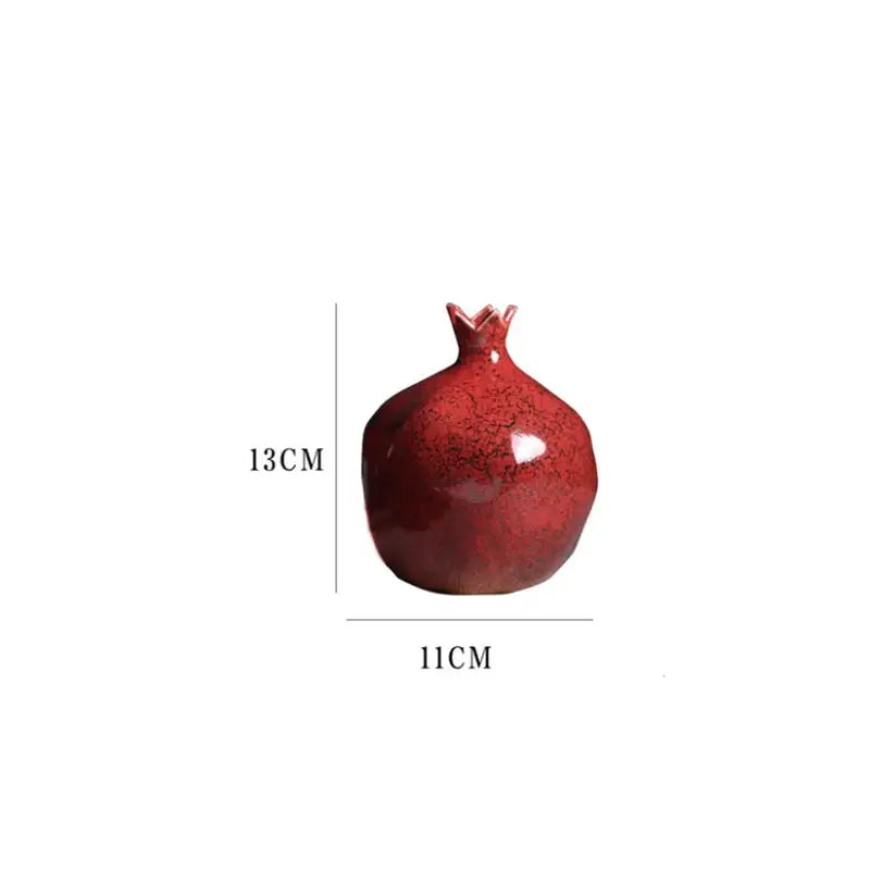 A glossy crimson red pomegranate ceramic vase 13cm tall for modern home decor by DecorBites
