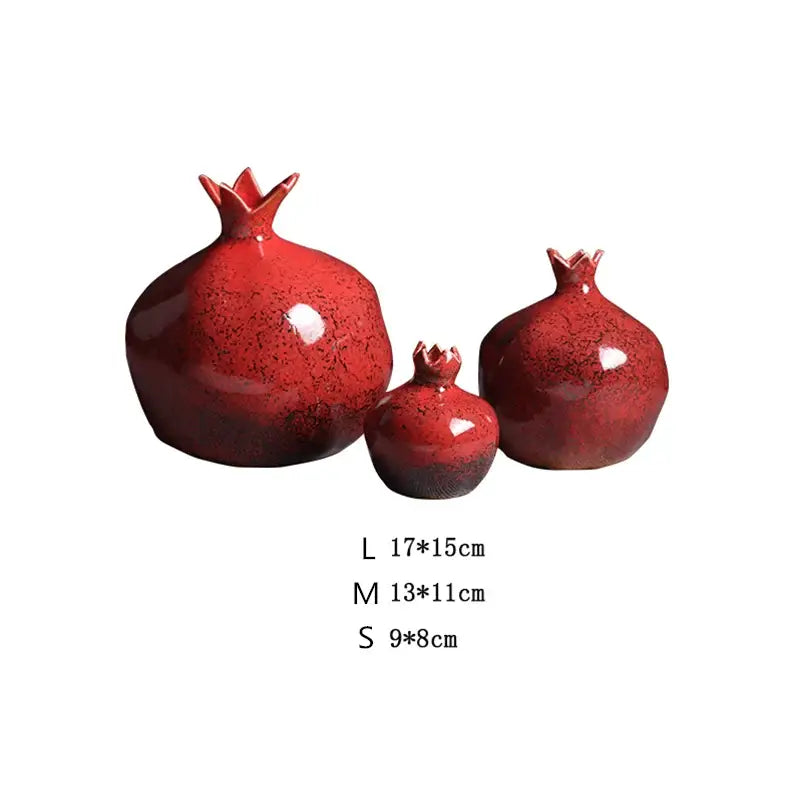 Set of three glossy red pomegranate ceramic vases in varying sizes for a modern home by DecorBites