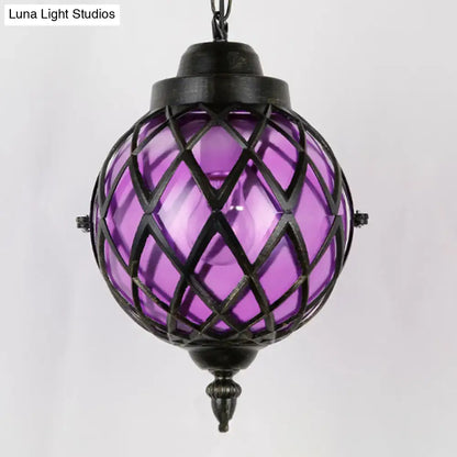 Decorbites restaurant pendant lighting featuring purple glass shade with black metal lattice ceiling light design