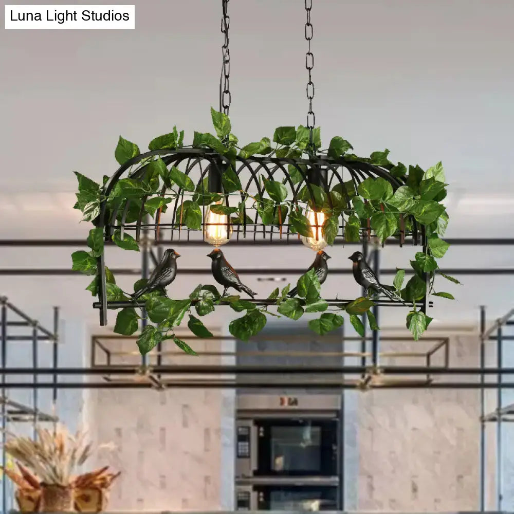 Black wrought iron retro birdcage island light fixture with artificial ivy bird figurines and two edison bulbs