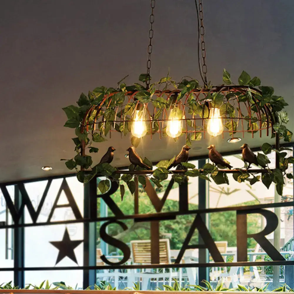 Decorbites retro birdcage island light fixture black metal with green vines birds and three glowing edison bulbs