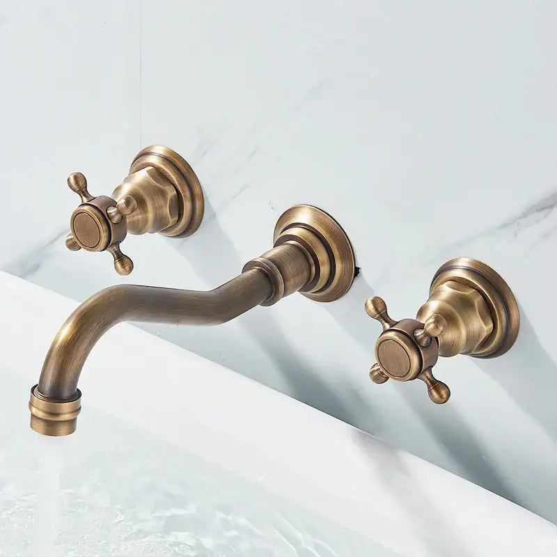 Antique brass DecorBites™ retro color wall mounted bathroom faucet with dual cross handles and curved spout