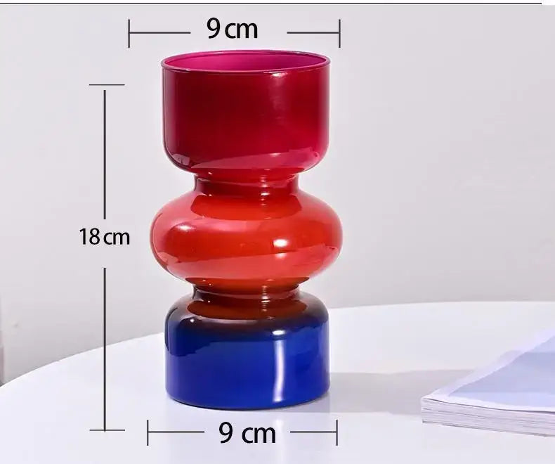 Decorbites™ retro glass vase featuring a vibrant three-tiered glass design in red, orange, and blue for flower arrangements