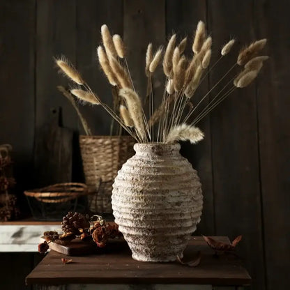 DecorBites™ retro handmade white ceramic vase with horizontal ridges holding dried beige bunny tail grass bouquet